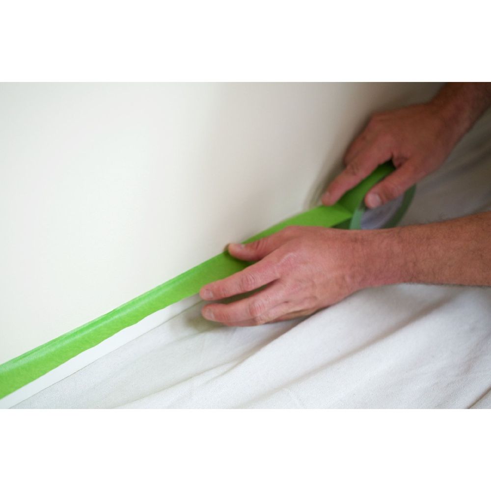 Applying FrogTape green painter’s tape for clean paint lines