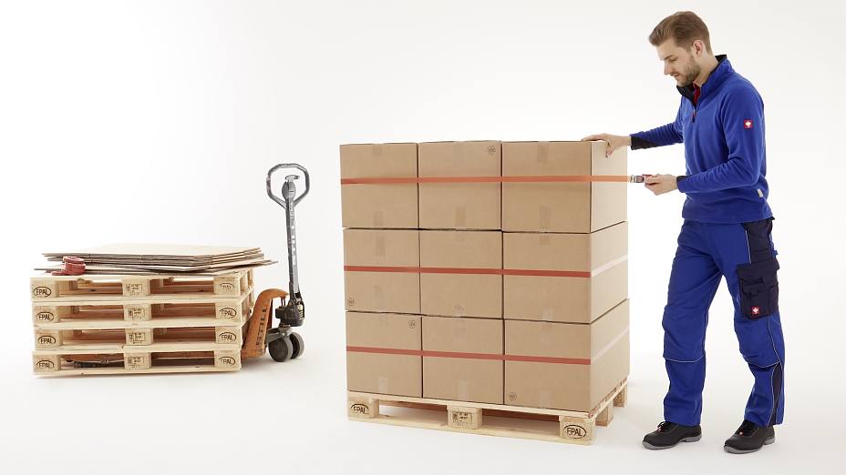 Worker Strapping Pallet Boxes with Orange Strapping Tape 4287