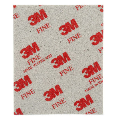 Single 3M 03809 fine grade softback sanding sponge 115mm x 140mm showing grey foam abrasive face with red 3M Fine branding made in England for flexible contour sanding on paint primer and filler