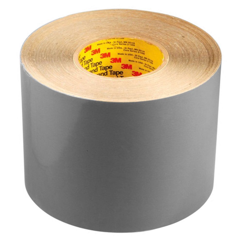Full standing cylinder roll of 3M Flexomount grey plate mounting tape 411DL on a clean white background