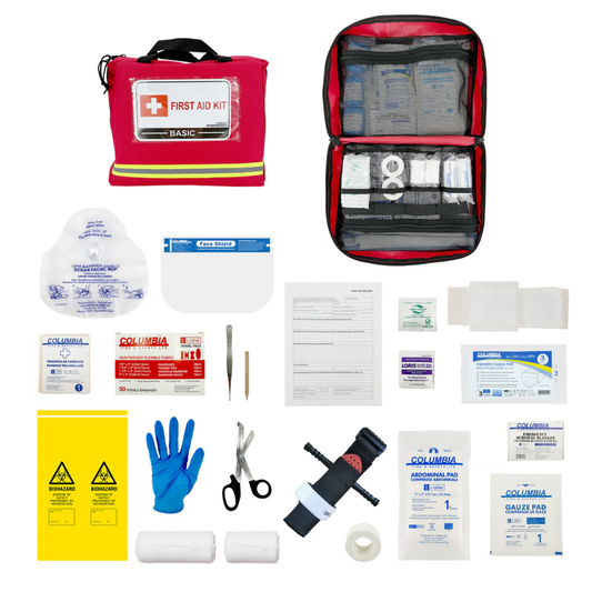 Detailed flat lay display of all the specific medical supplies included in the WorkSafeBC Basic First Aid Kit for regulatory compliance.