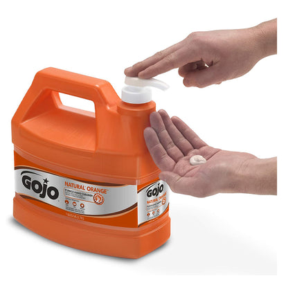 GOJO Natural Orange Pumice Hand Cleaner 1 gallon bottle being pumped into a hand to clean dirt, grease, and oil.