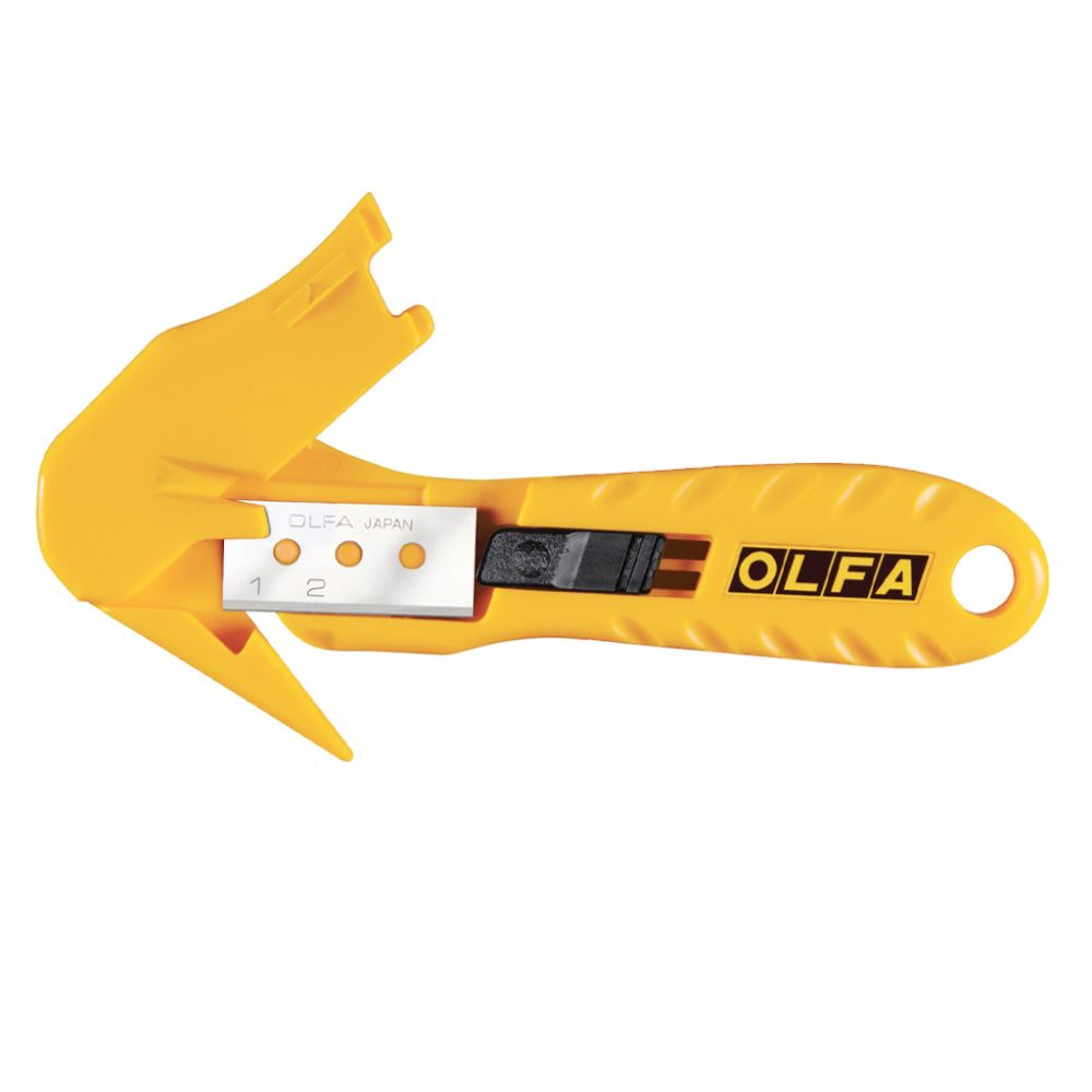 Warehouse worker using OLFA safety cutter to slice through plastic strapping on a pallet