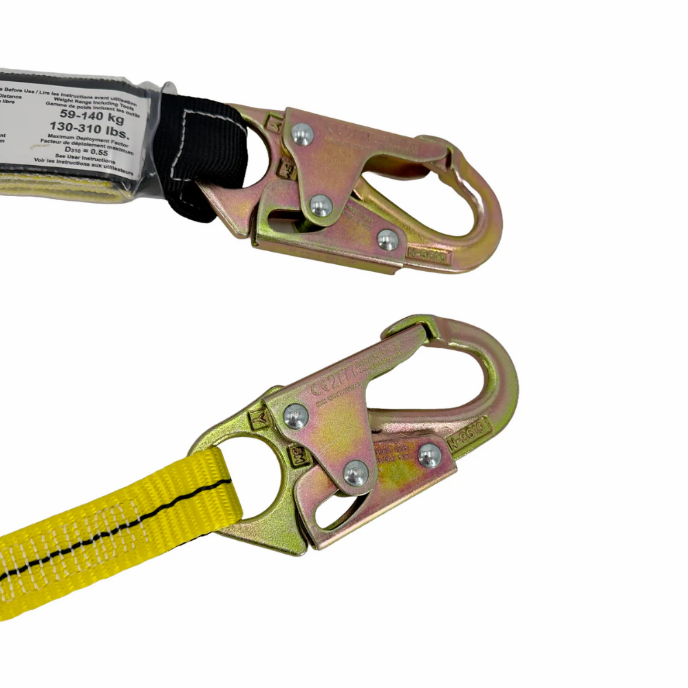 Close-up view of the clear-jacketed deceleration shock pack on the LEO 4ft safety lanyard, showcasing compliant internal tear-webbing and warning labels.