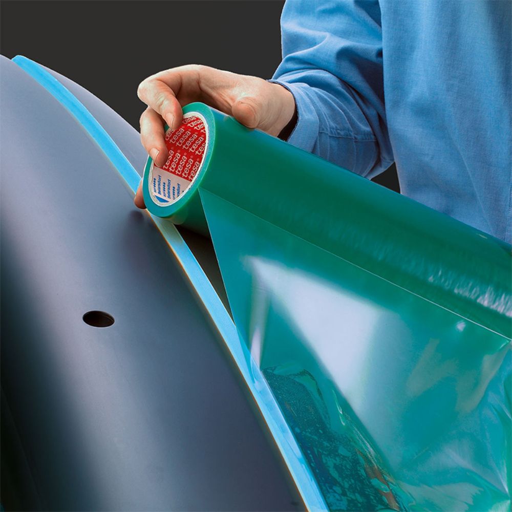 Applying Tesa Green Polyethylene Surface Protection Tape on Panel