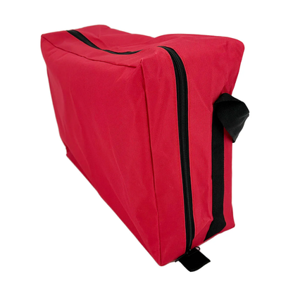 Side view of the red LEO emergency trauma backpack with the front zipper pouch open to reveal inner organizer slots.