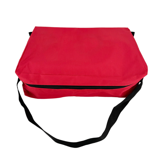 Inside view of the spacious empty main compartment of the red LEO nylon first aid bag with interior liner pockets.