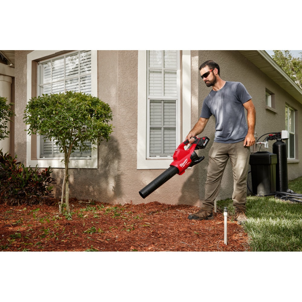 The Milwaukee 2824-20 M18 FUEL Blower, a brushless 18-volt cordless handheld tool delivering 145 MPH and 600 CFM for heavy-duty clearing.