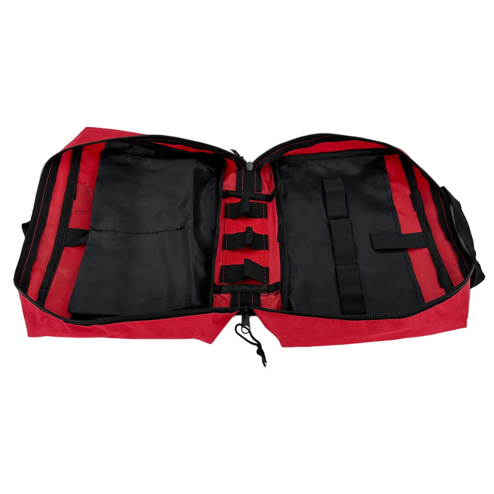 Empty red first aid kit bag open with black elastic loops and storage compartments