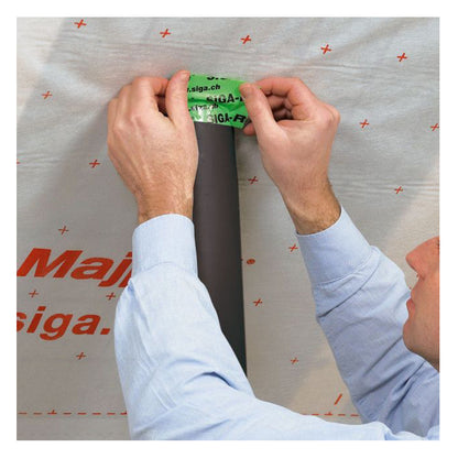 A close-up photograph of a single 96mm wide roll of clear Scapa 134 UV-resistant polyethylene tape, highlighting the red core logos and thick film backing, ready for exterior industrial use