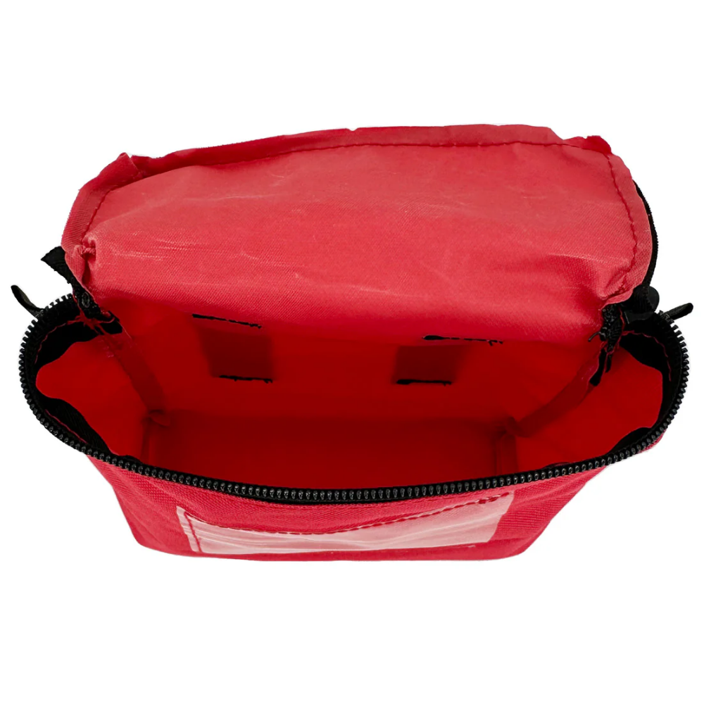 Small red first aid pouch open top view showing red interior compartment
