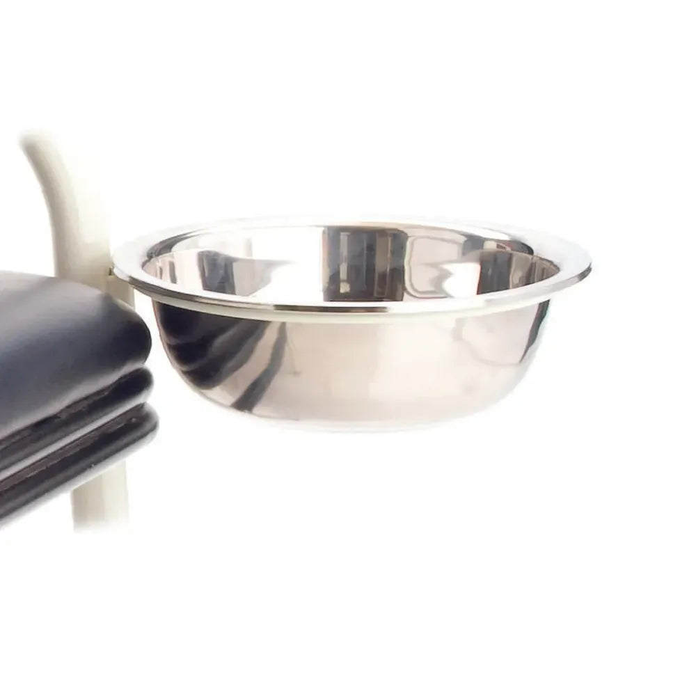 A stainless steel medical wash basin securely mounted in a white ring holder attachment on a clinical stand.
