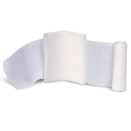 Unrolled 6x6 inch sterile compress trauma dressing featuring a thick absorbent center pad and attached long gauze ties for secure wound pressure.
