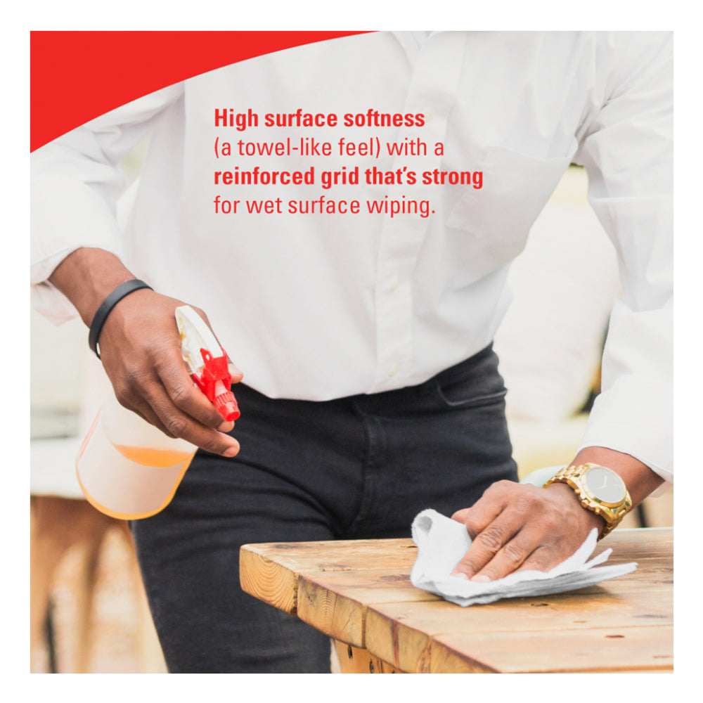 WypAll L30 cleaning towel in use wiping wooden surface with spray cleaner, soft reinforced grid wet wiping