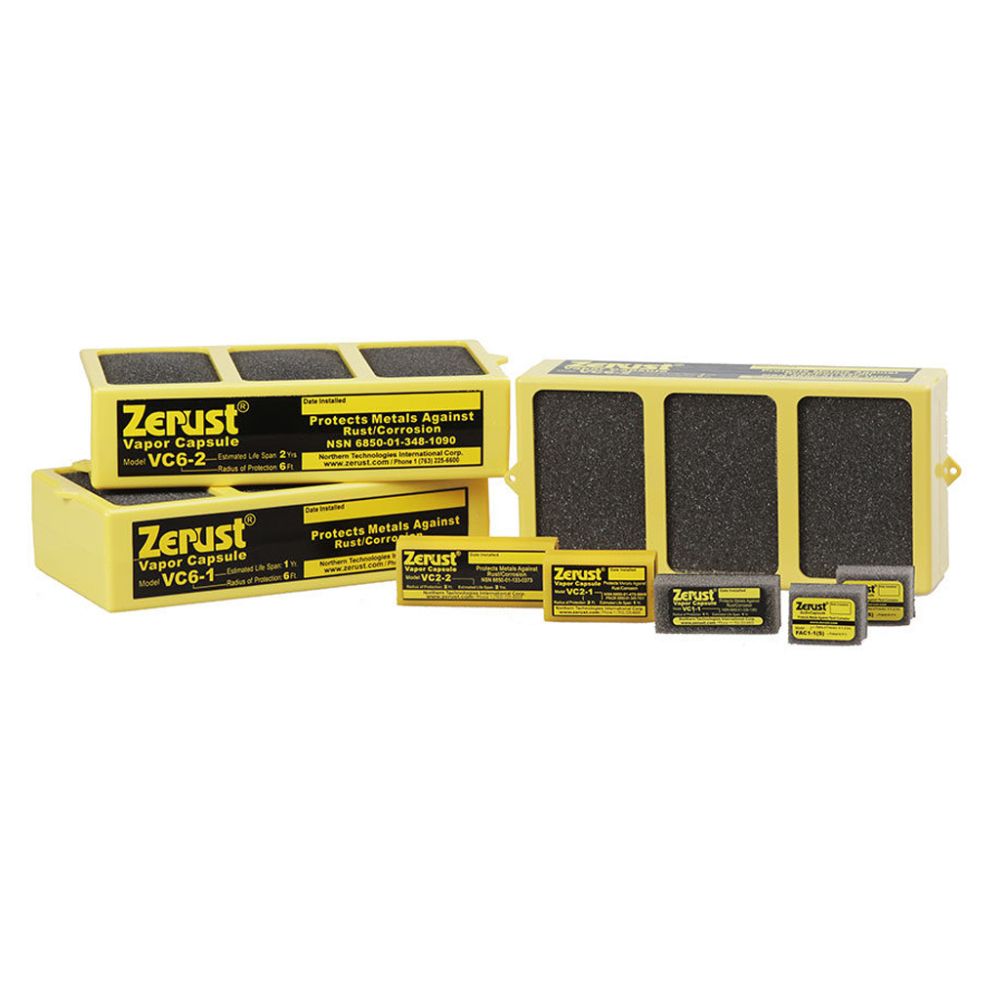 An assortment of yellow plastic grid and grey foam Zerust VCI vapor capsules in various commercial models and sizes